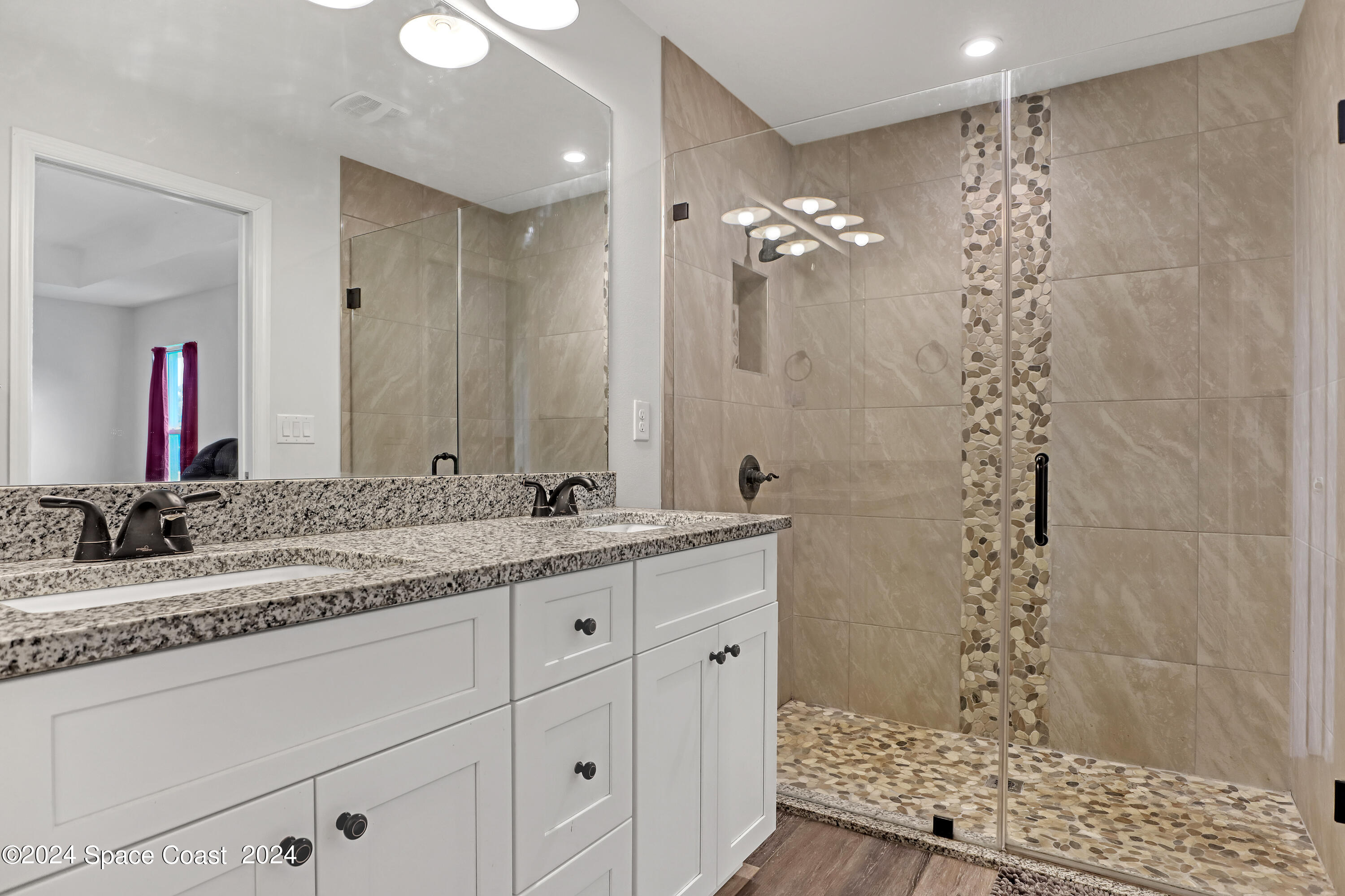 4383 Prentice Lane Mims, FL 32754 - Photo 28 of 48 a bathroom with a double vanity sink and a mirror