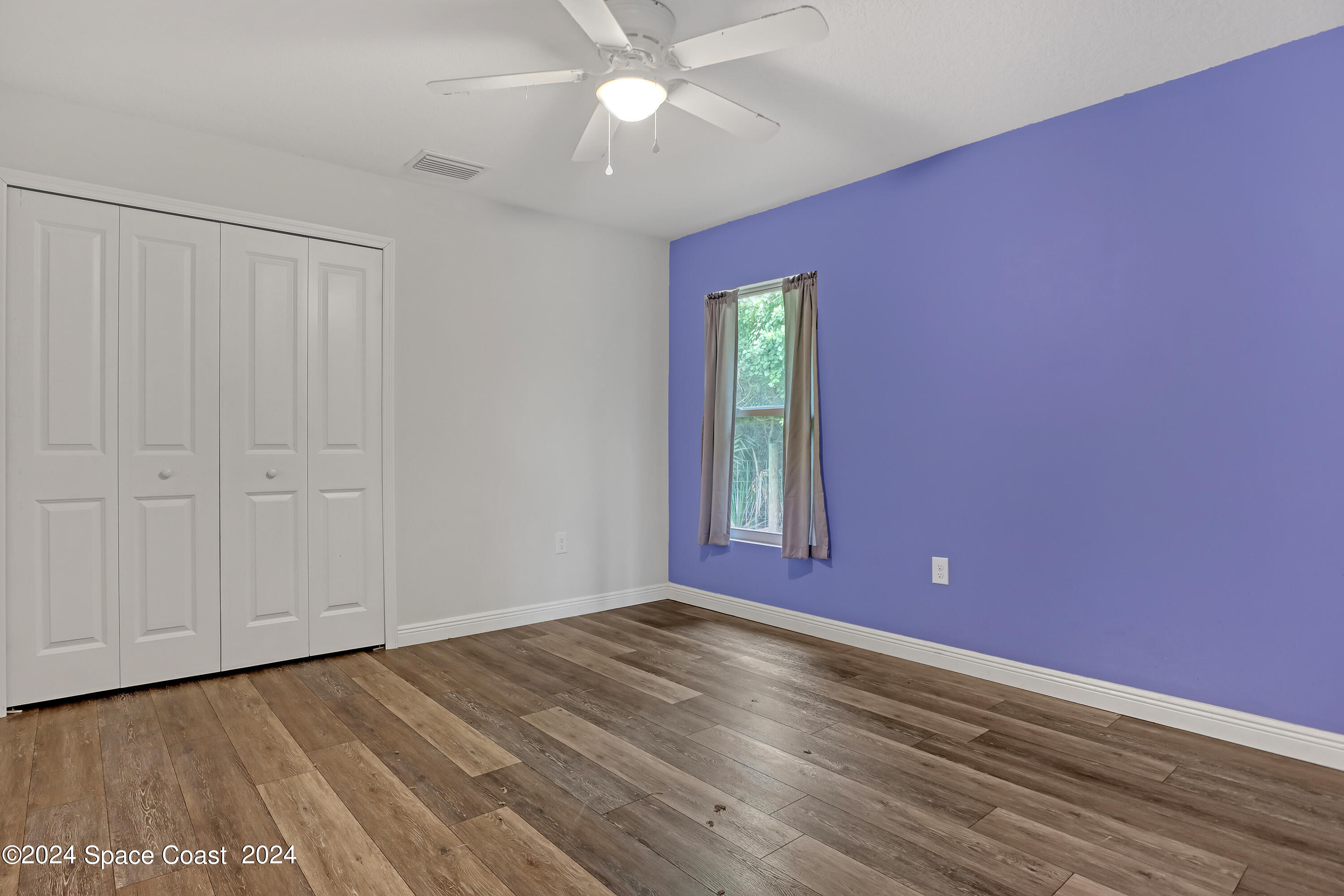 4383 Prentice Lane Mims, FL 32754 - Photo 29 of 48 a view of empty room with window and ceiling fan