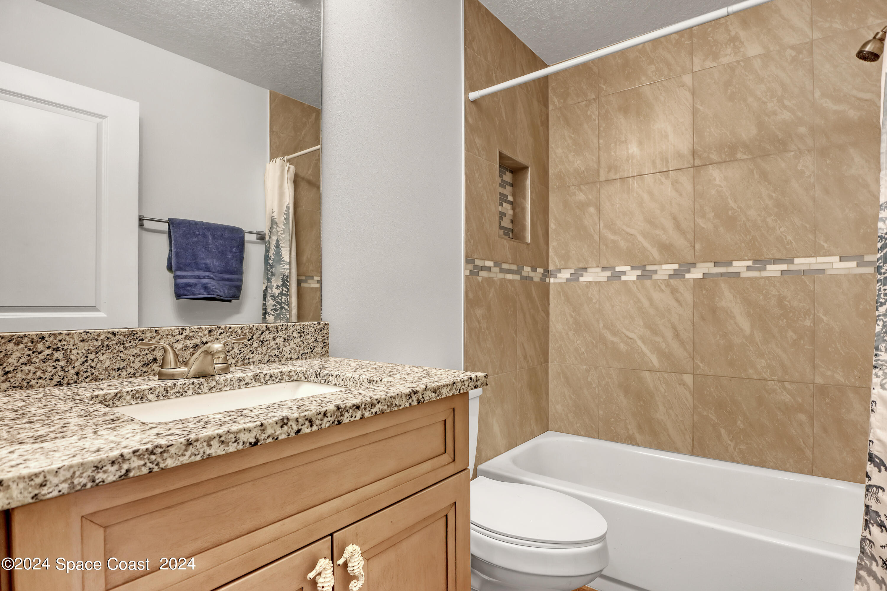 4383 Prentice Lane Mims, FL 32754 - Photo 34 of 48 a bathroom with a granite countertop sink a toilet and bathtub