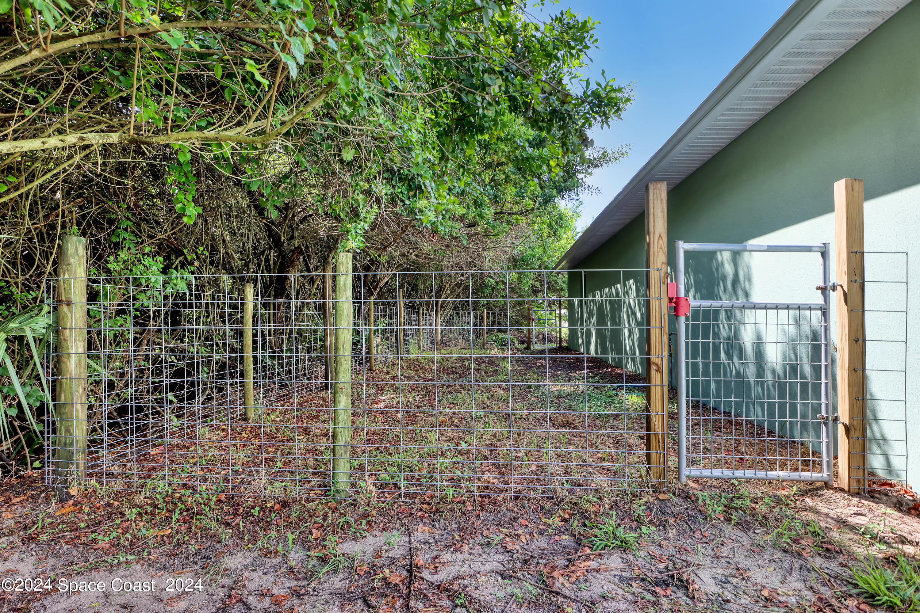 4383 Prentice Lane Mims, FL 32754 - Photo 38 of 48 a backyard of a house with lots of green space