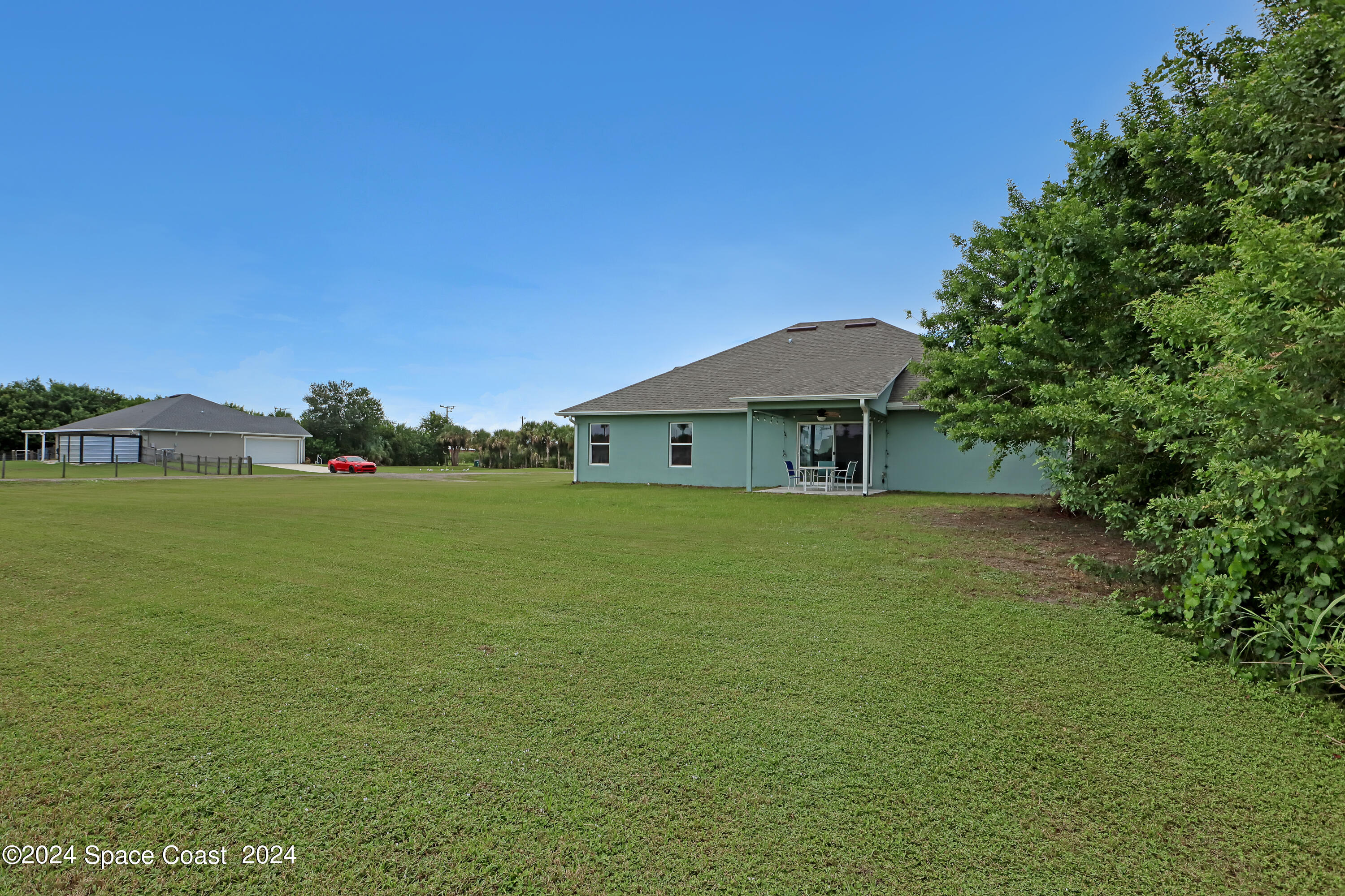 4383 Prentice Lane Mims, FL 32754 - Photo 4 of 48 a front view of a house with garden