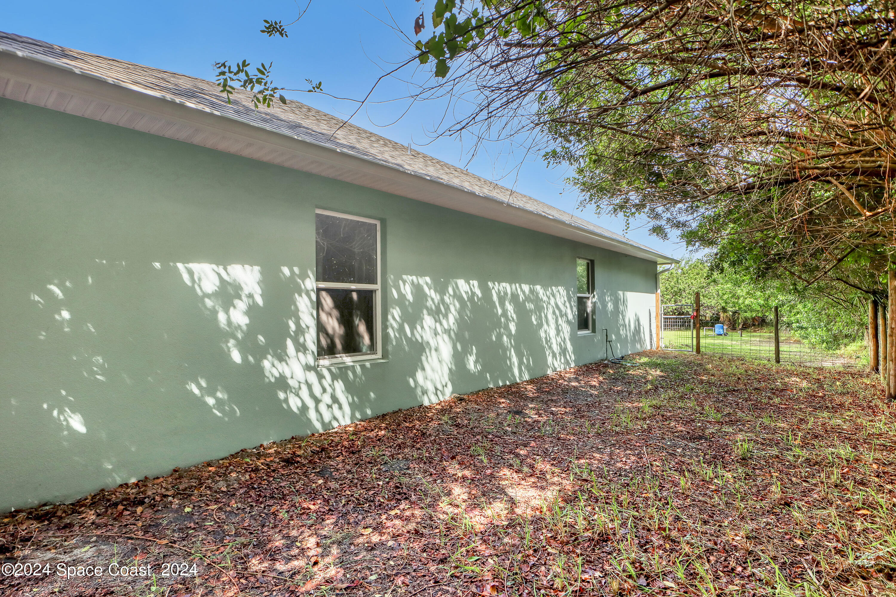 4383 Prentice Lane Mims, FL 32754 - Photo 41 of 48 a front view of a house with garden