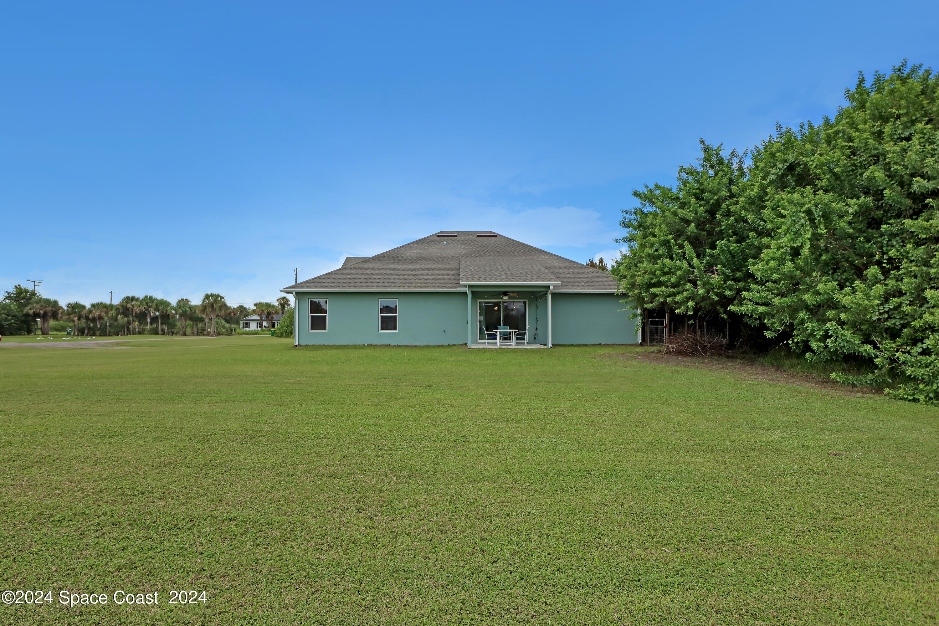 4383 Prentice Lane Mims, FL 32754 - Photo 44 of 48 a front view of a house with a garden
