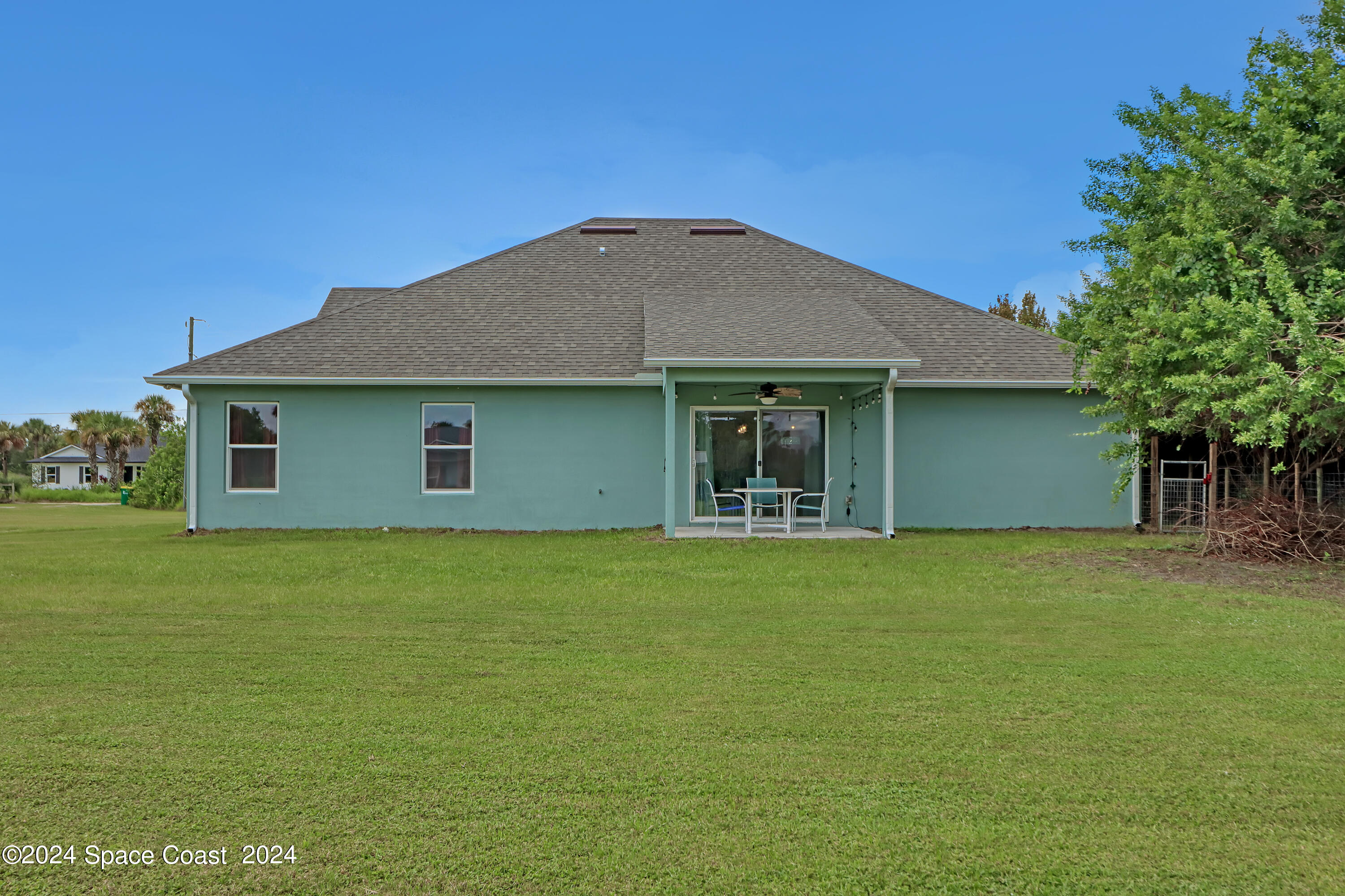 4383 Prentice Lane Mims, FL 32754 - Photo 45 of 48 a front view of a house with a garden