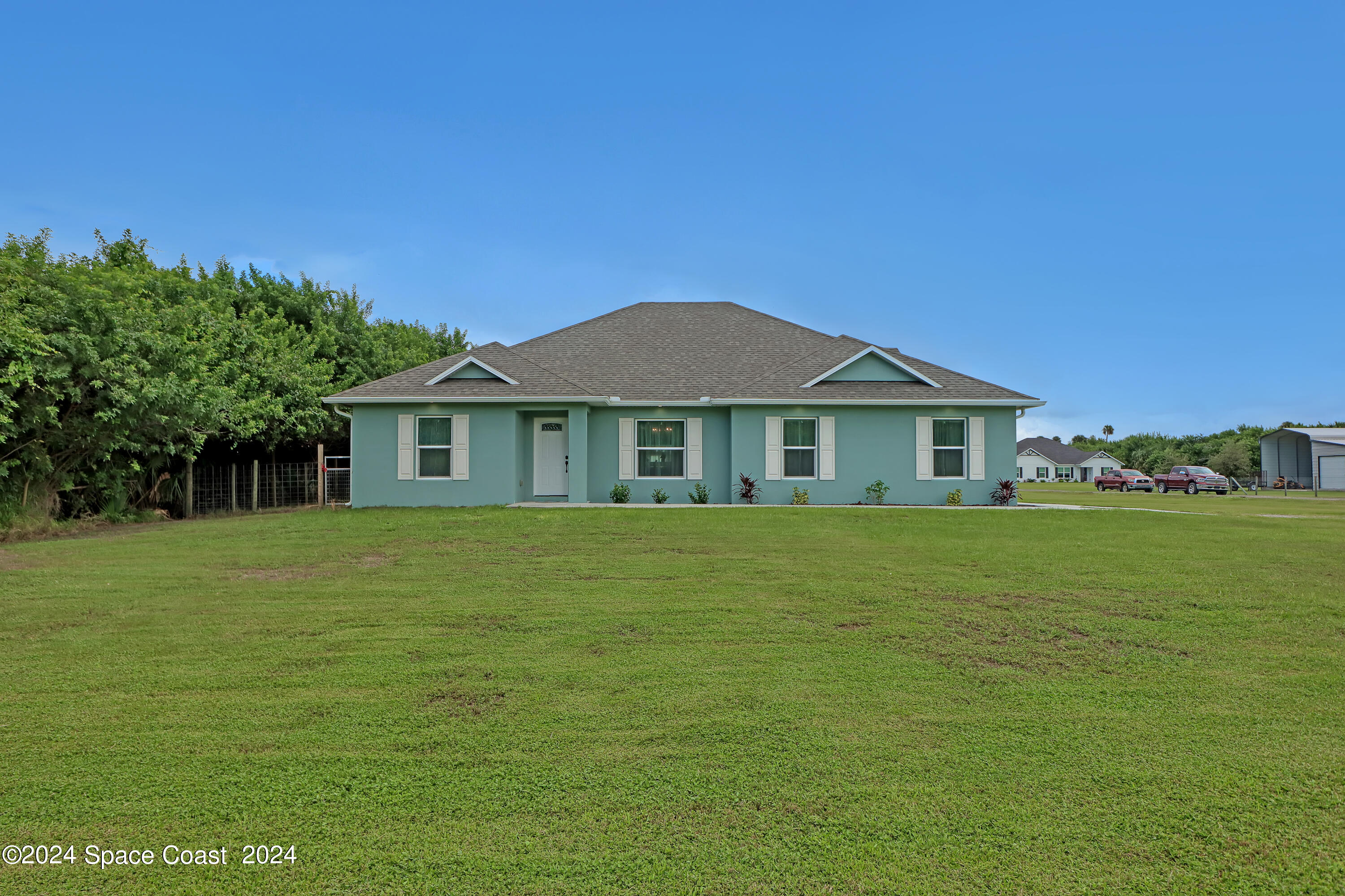 4383 Prentice Lane Mims, FL 32754 - Photo 47 of 48 a front view of a house with a garden