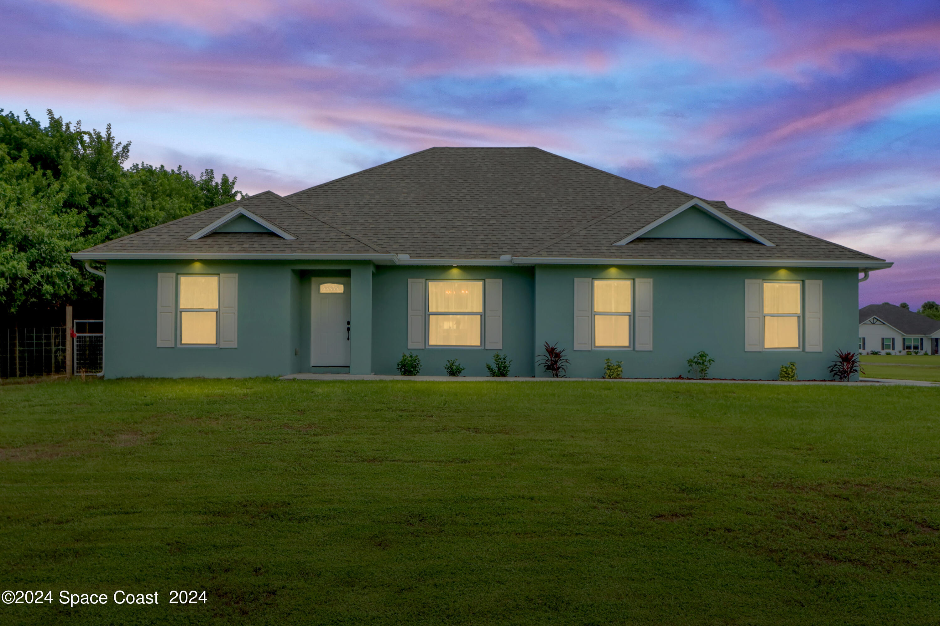 4383 Prentice Lane Mims, FL 32754 - Photo 48 of 48 a front view of a house with a garden