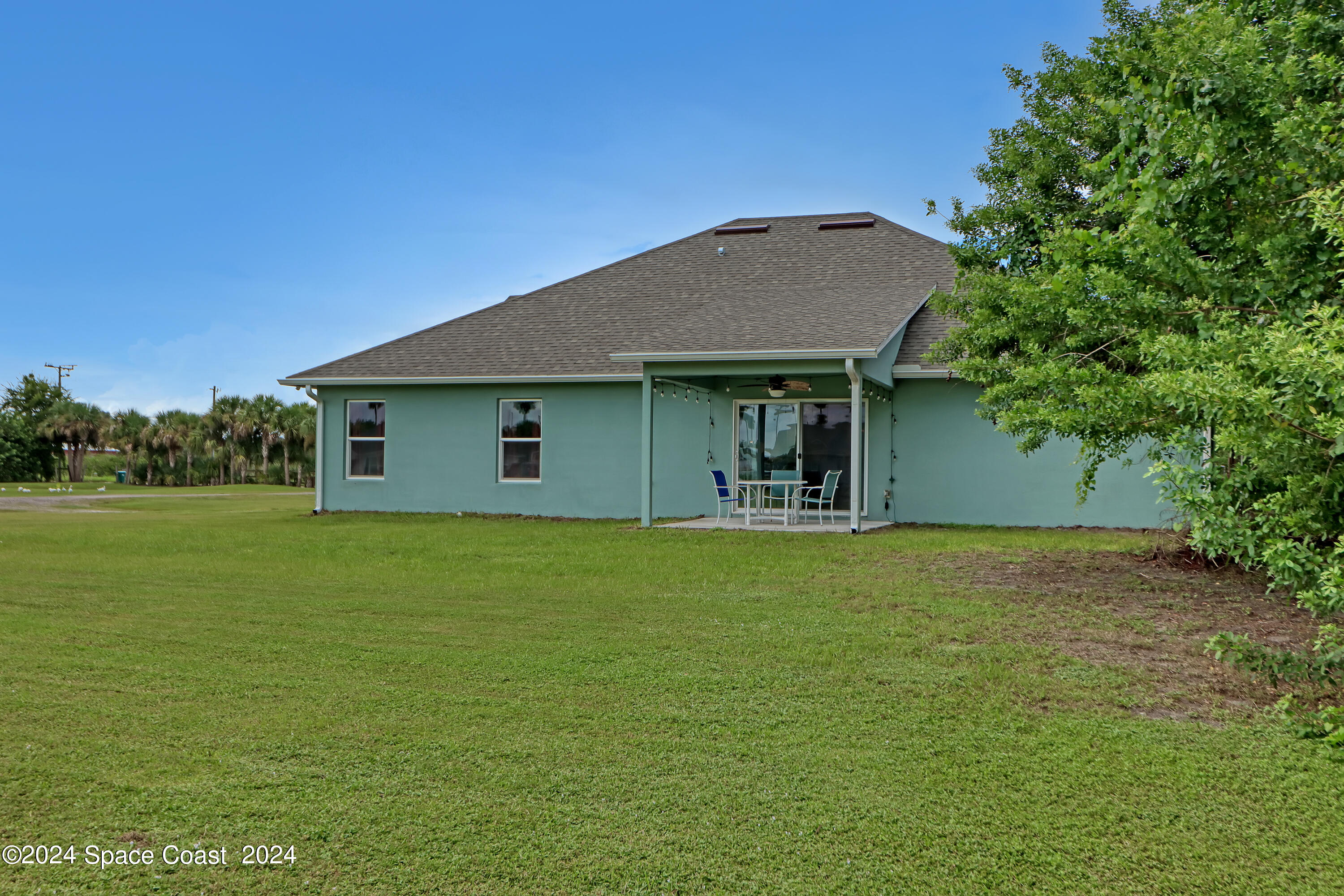 4383 Prentice Lane Mims, FL 32754 - Photo 5 of 48 a front view of a house with a garden