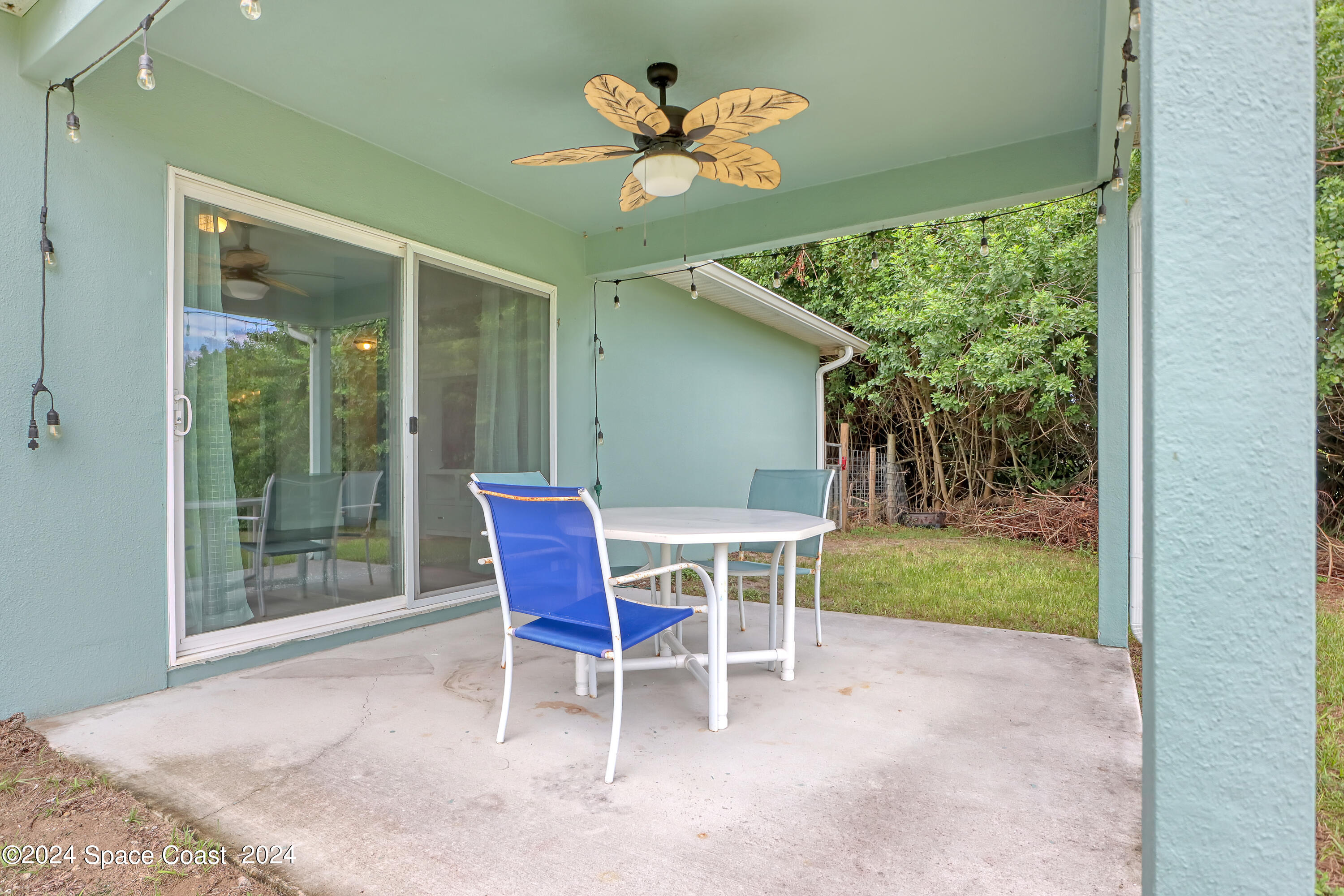 4383 Prentice Lane Mims, FL 32754 - Photo 7 of 48 a view of a porch with chairs and a table