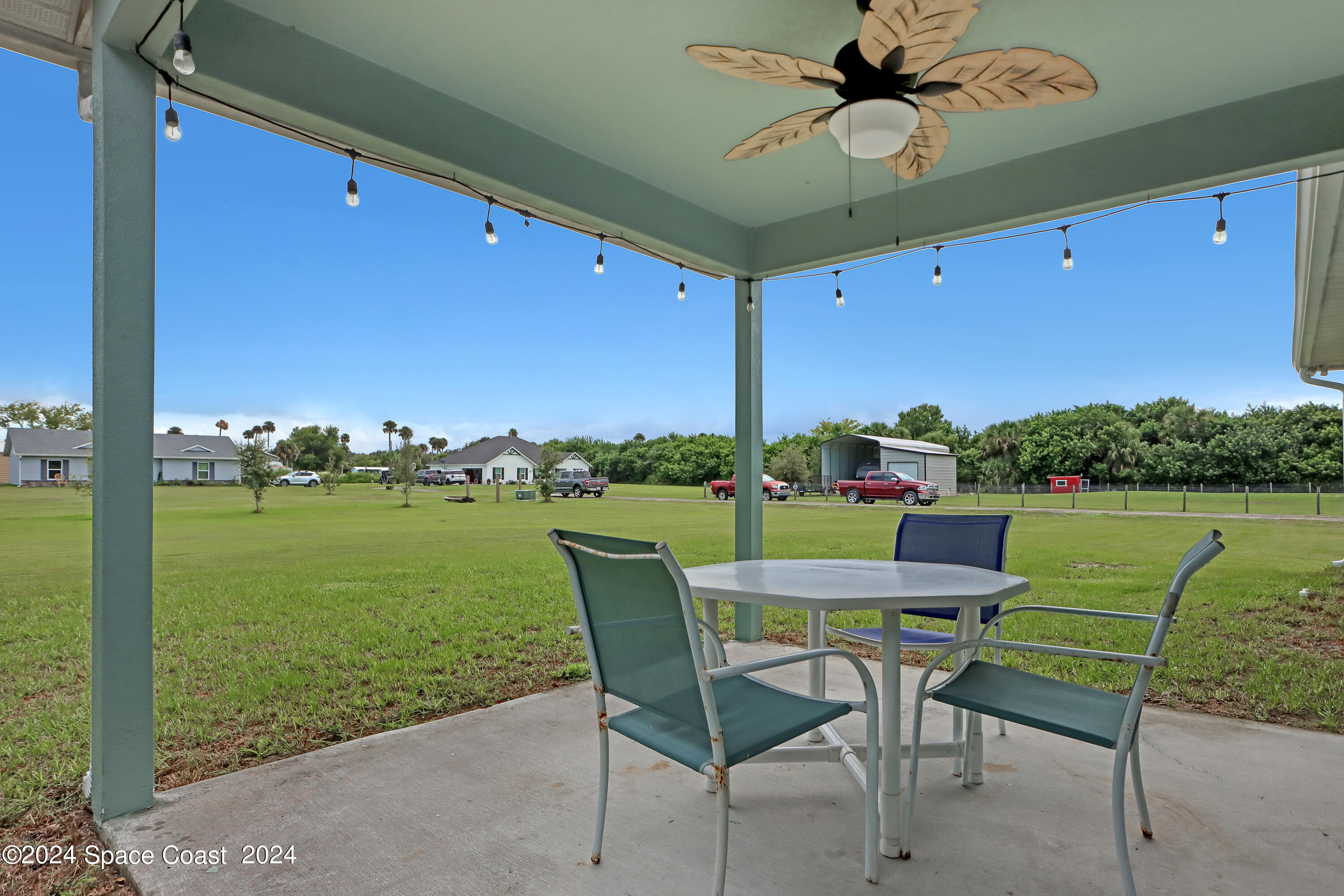 4383 Prentice Lane Mims, FL 32754 - Photo 8 of 48 a patio with water view fountain and a table