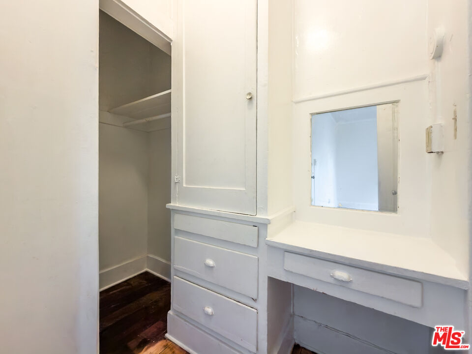 434 South Rampart Boulevard, Unit 108 Los Angeles, CA 90057 - Photo 13 of 18 a bathroom with a sink and a mirror