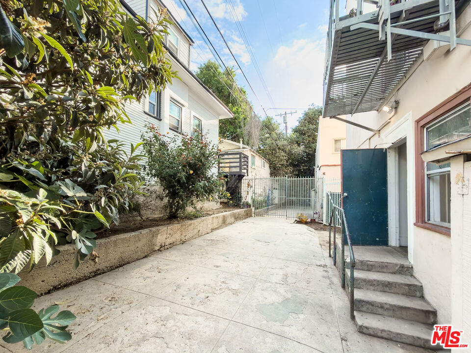 434 South Rampart Boulevard, Unit 108 Los Angeles, CA 90057 - Photo 16 of 18 a front view of a house with a yard