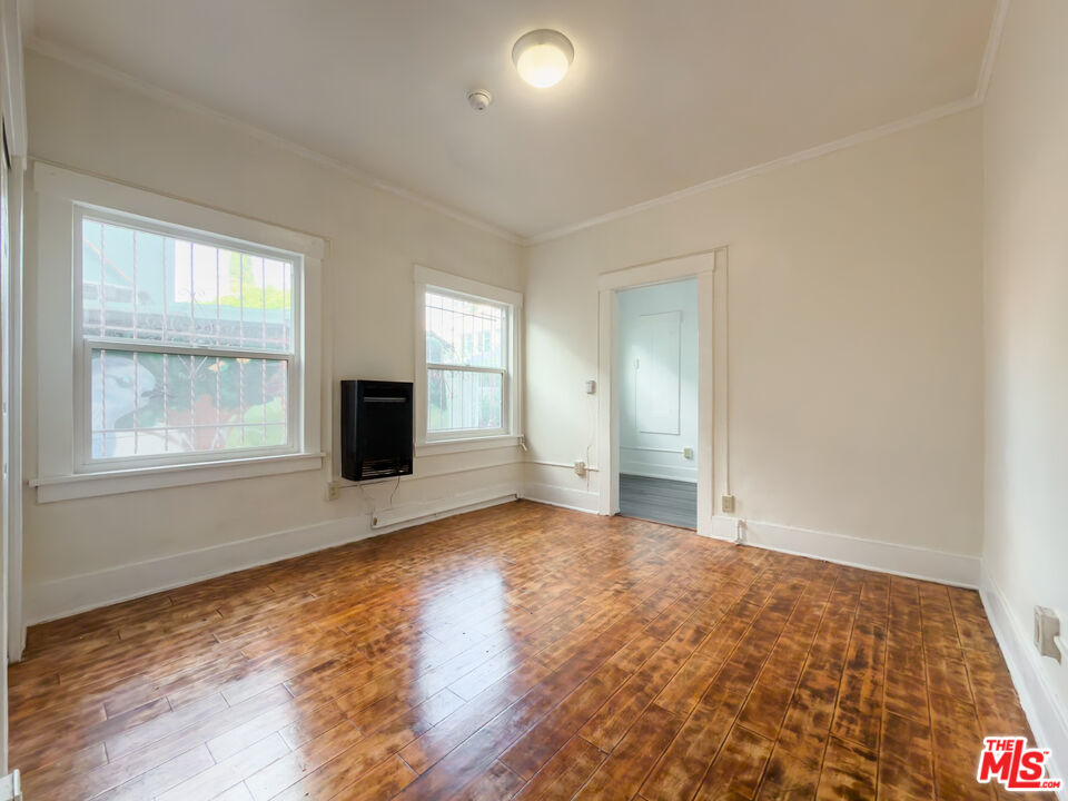 434 South Rampart Boulevard, Unit 108 Los Angeles, CA 90057 - Photo 5 of 18 a view of an empty room with window and fire place