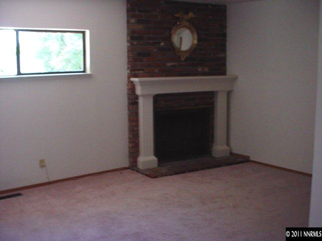 4000 Jasper Lane Reno, NV 89509 - Photo 4 of 10 a living room with a fireplace