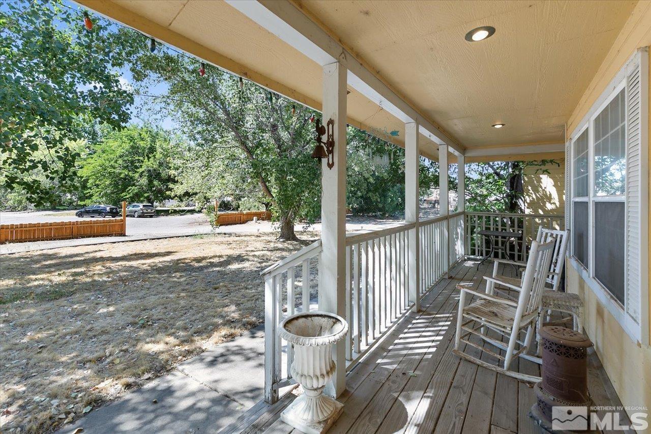 5790 Hooper Place Fallon, NV 89406 - Photo 22 of 39 a view of a porch with wooden floor next to a yard