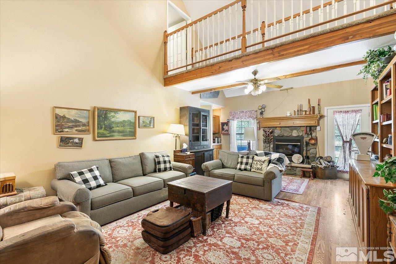 5790 Hooper Place Fallon, NV 89406 - Photo 23 of 39 a living room with fireplace furniture and a rug