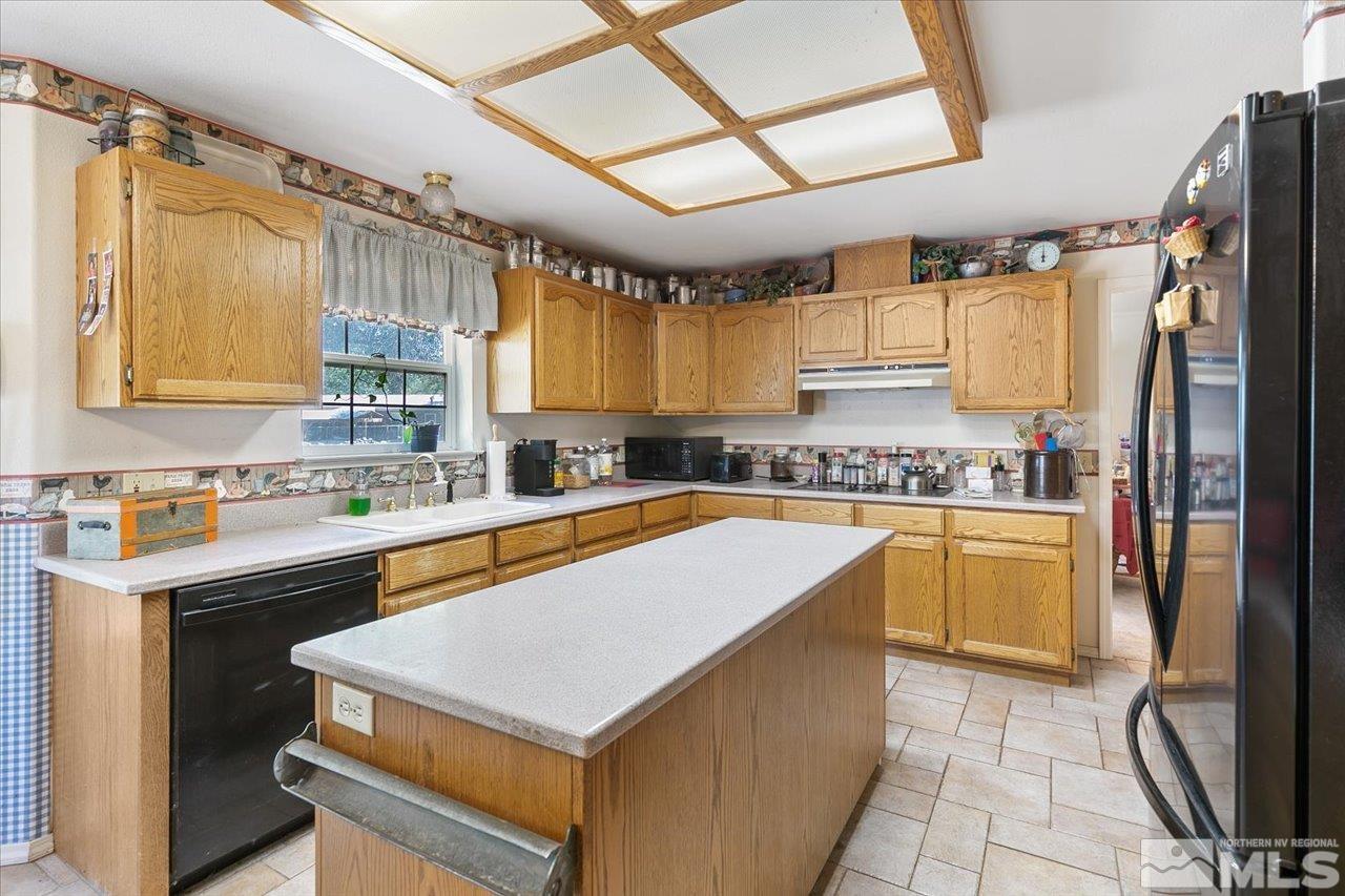 5790 Hooper Place Fallon, NV 89406 - Photo 26 of 39 a kitchen with stainless steel appliances a stove sink and cabinets