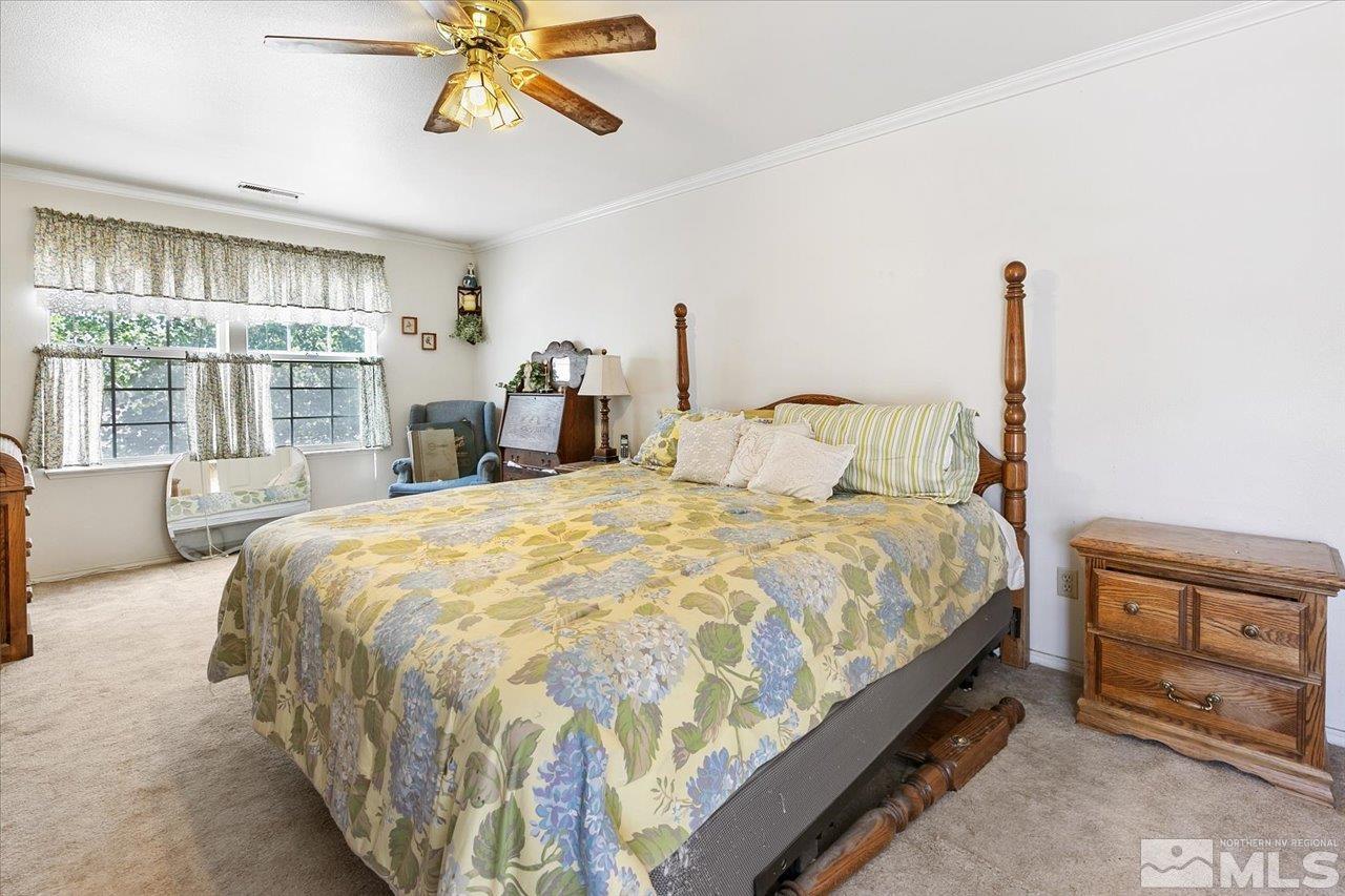 5790 Hooper Place Fallon, NV 89406 - Photo 27 of 39 a bedroom with a bed and a large window
