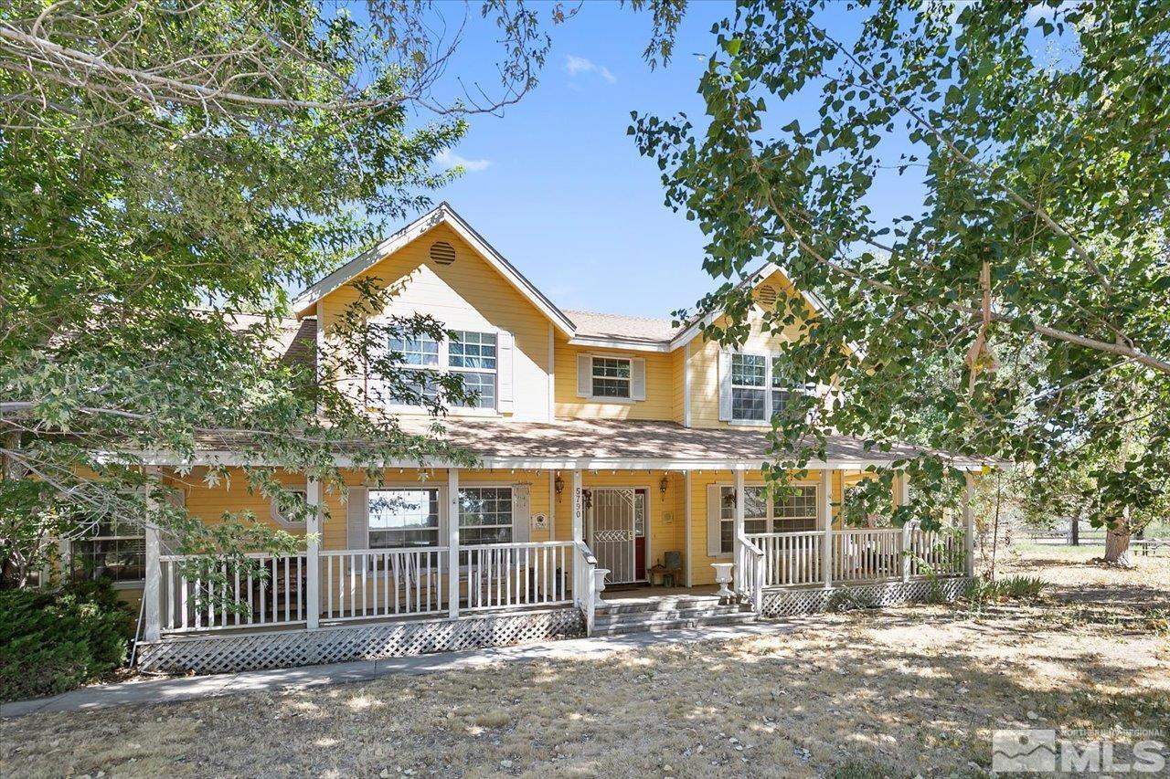 5790 Hooper Place Fallon, NV 89406 - Photo 3 of 39 a front view of a house with a yard