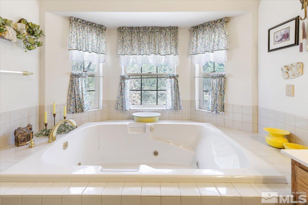 5790 Hooper Place Fallon, NV 89406 - Photo 31 of 39 a white bath tub sitting next to a window