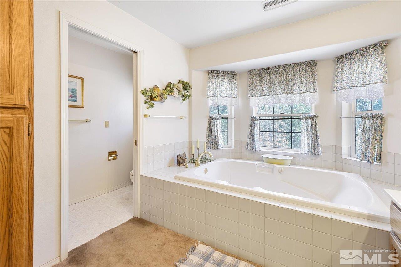 5790 Hooper Place Fallon, NV 89406 - Photo 32 of 39 a spacious bathroom with a bathtub and shower