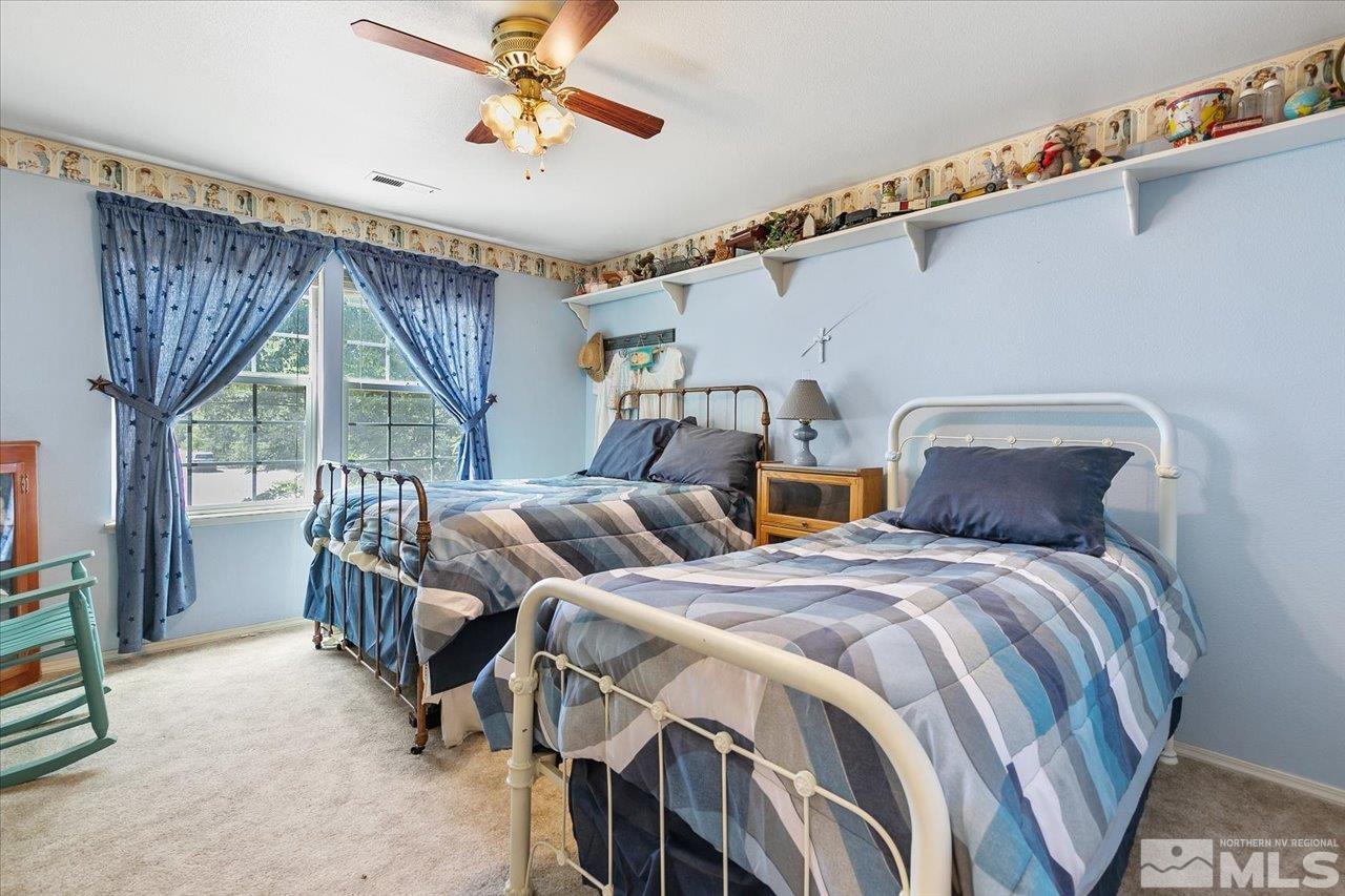 5790 Hooper Place Fallon, NV 89406 - Photo 36 of 39 a bedroom with two beds and a large window
