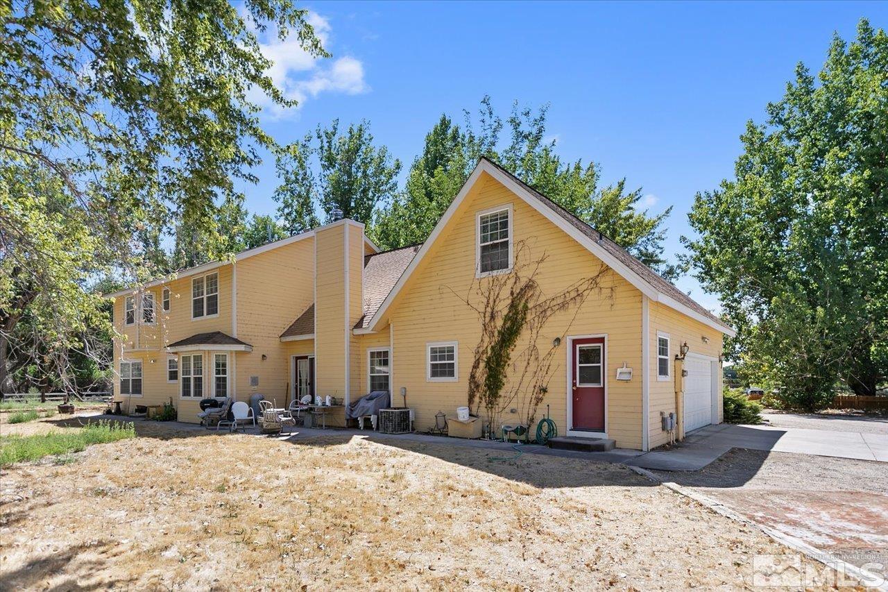 5790 Hooper Place Fallon, NV 89406 - Photo 4 of 39 a view of a white house with a yard
