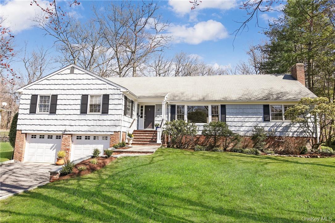 a front view of house with yard and outdoor seating