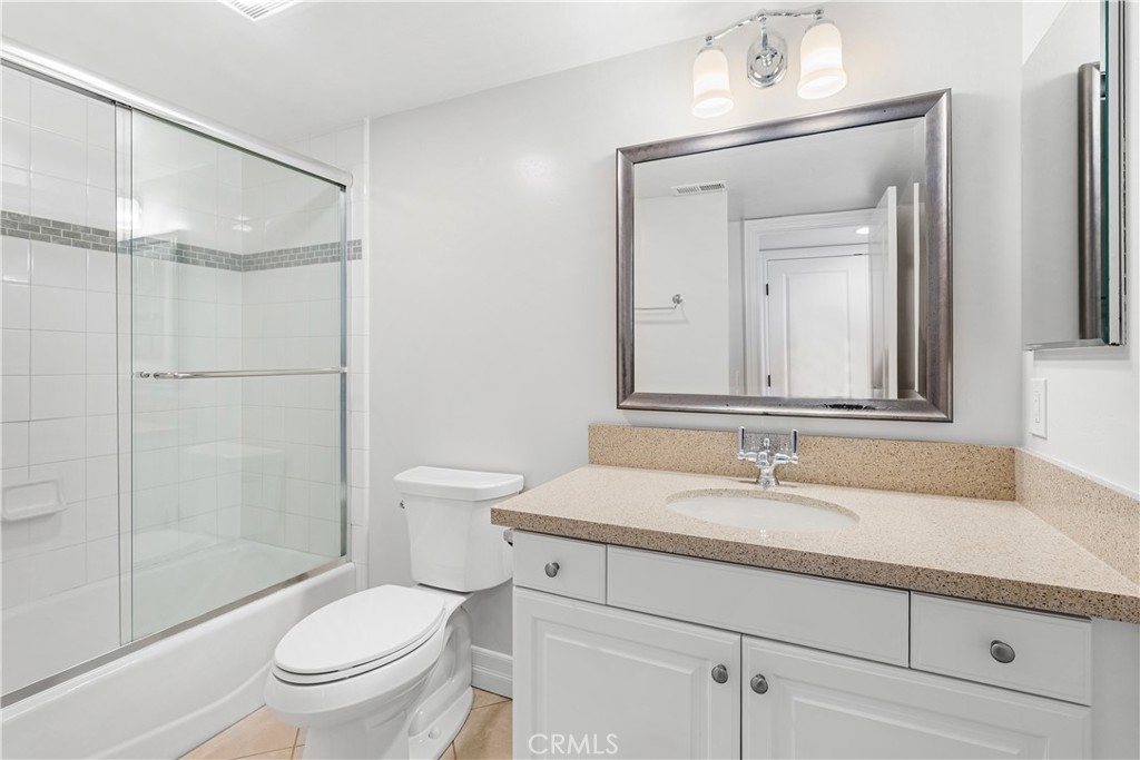 34002 Selva Road, Unit 369 Dana Point, CA 92629 - Photo 11 of 31 a bathroom with a sink a toilet and shower