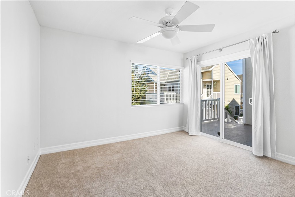 34002 Selva Road, Unit 369 Dana Point, CA 92629 - Photo 13 of 31 an empty room with windows and fan