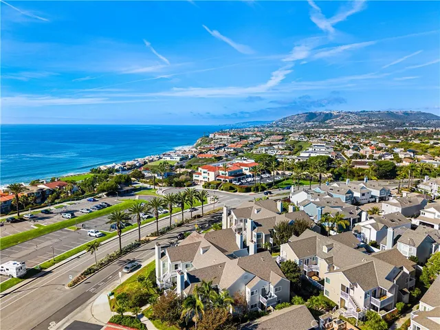 an aerial view of residential building and ocean