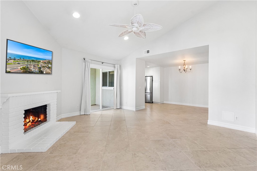 34002 Selva Road, Unit 369 Dana Point, CA 92629 - Photo 7 of 31 a view of an empty room with a fireplace