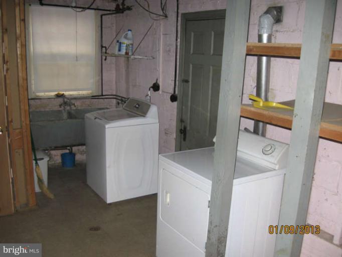 10124 Pierce Drive Silver Spring, MD 20901 - Photo 22 of 26 a bathroom with a sink and a mirror
