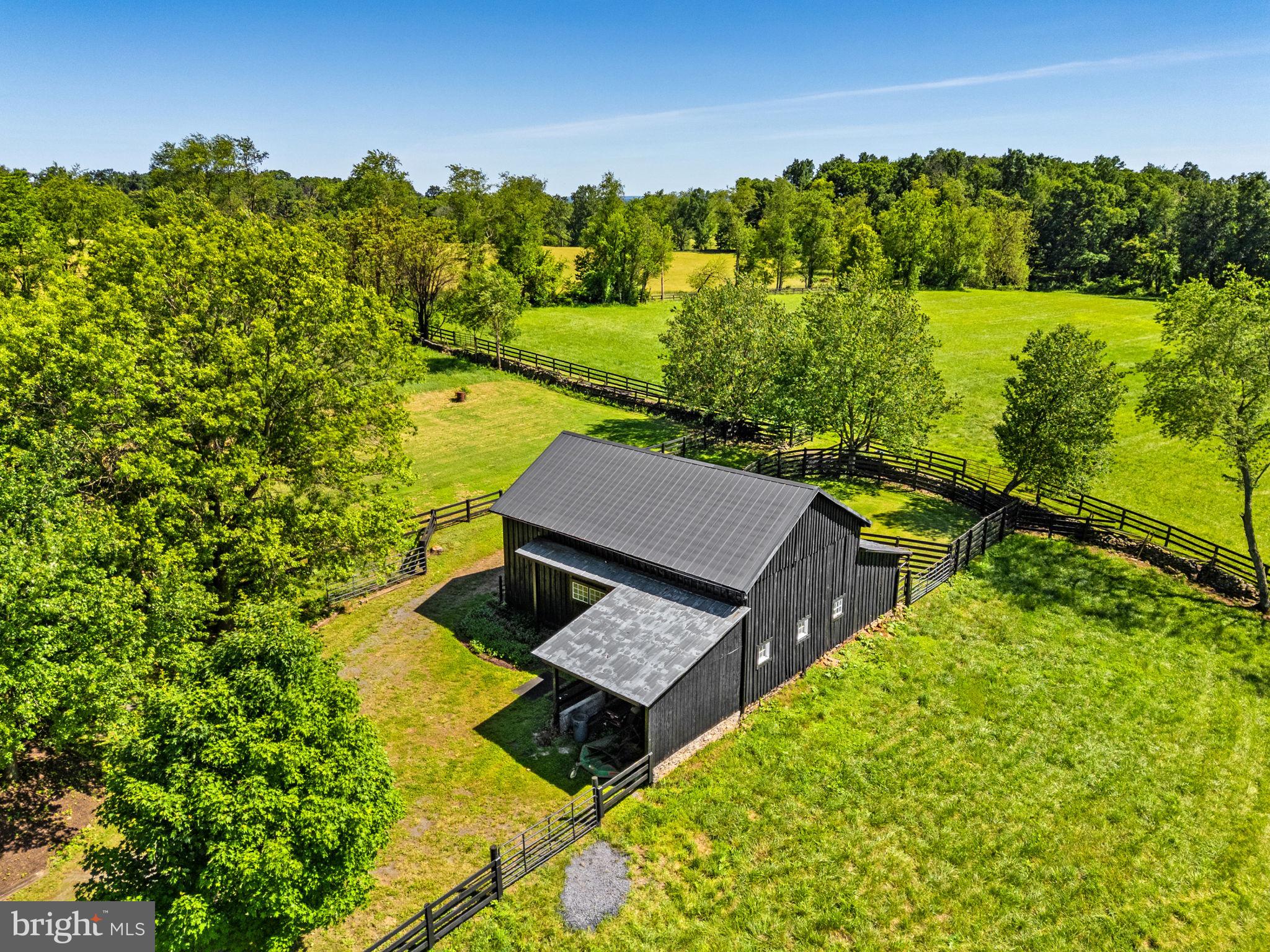 33195 Millville Road Upperville, VA 20184 - Photo 53 of 76 View of the barn surrounded by fenced pastures