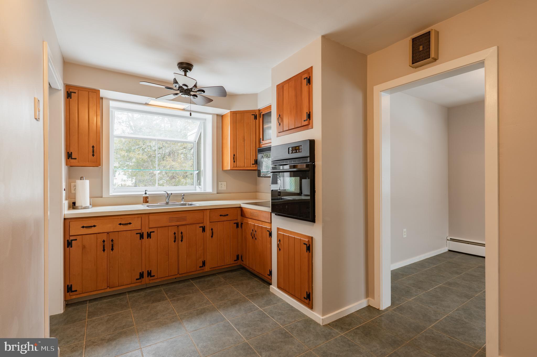 915 Cressman Road Harleysville, PA 19438 - Photo 11 of 39 a kitchen with granite countertop a refrigerator and a sink