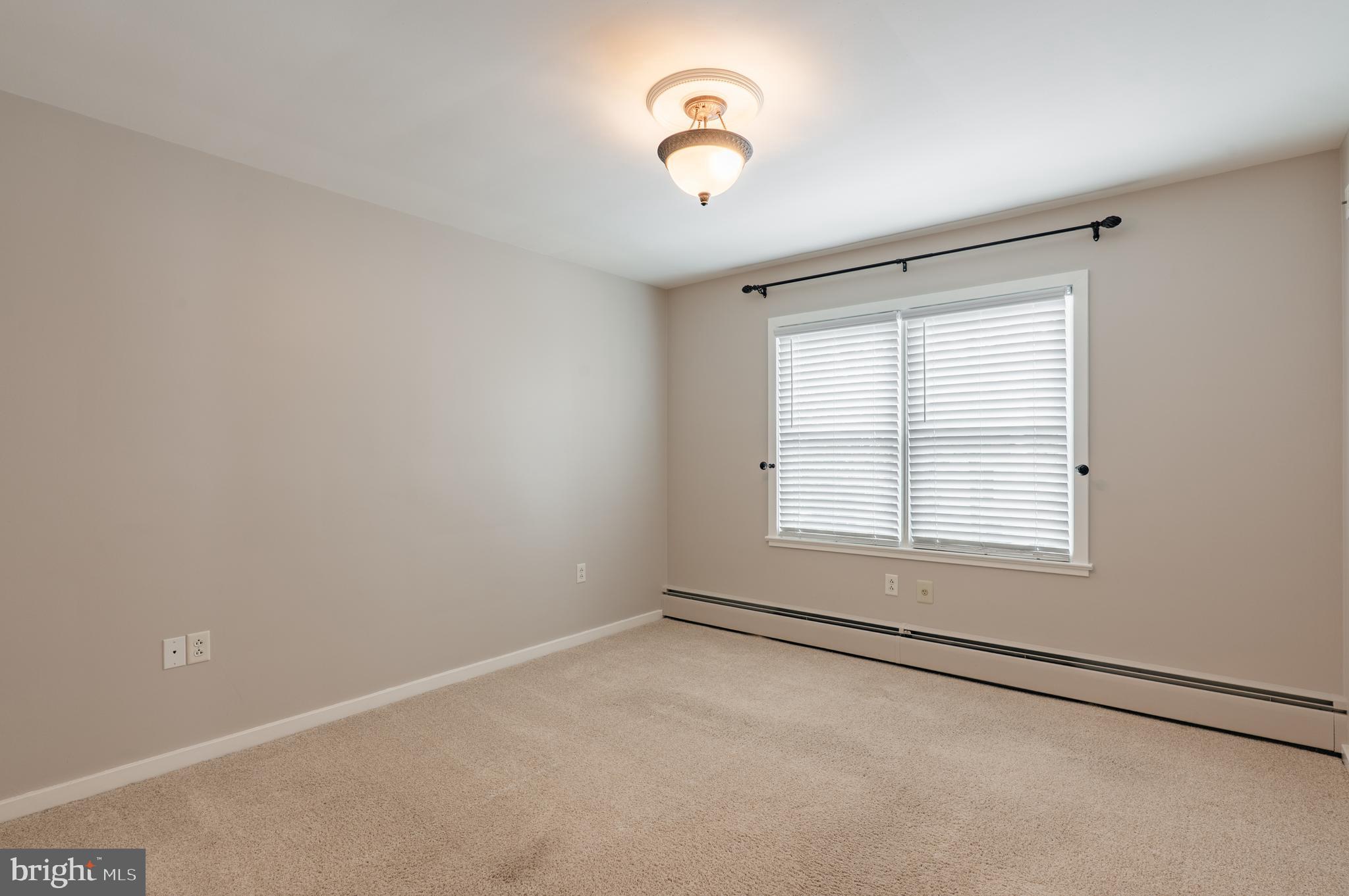 915 Cressman Road Harleysville, PA 19438 - Photo 19 of 39 an empty room with a empty space and windows