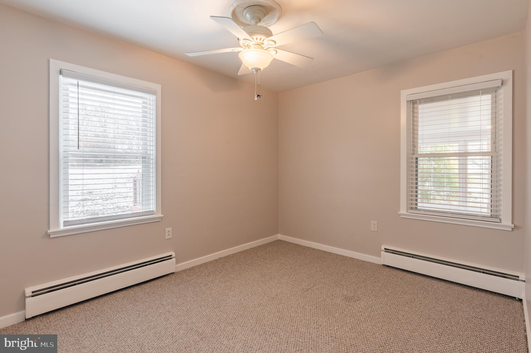 915 Cressman Road Harleysville, PA 19438 - Photo 20 of 39 an empty room with a window and a fan