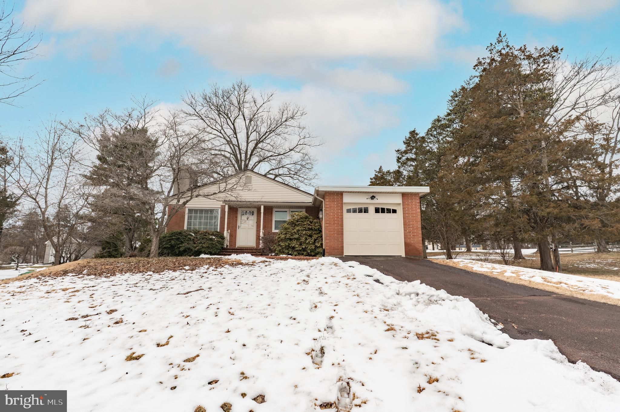 915 Cressman Road Harleysville, PA 19438 - Photo 2 of 39 a front view of a house with a yard covered in snow
