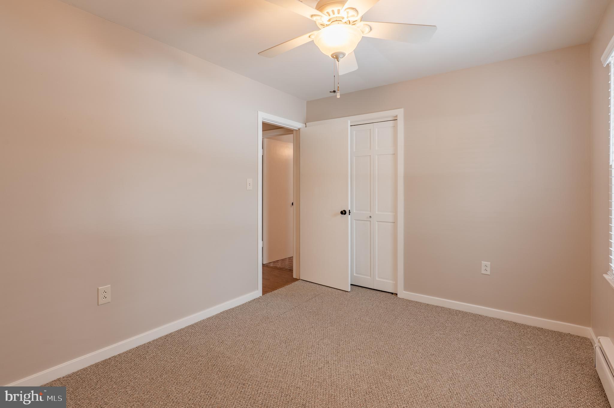 915 Cressman Road Harleysville, PA 19438 - Photo 21 of 39 an empty room with a chandelier fan