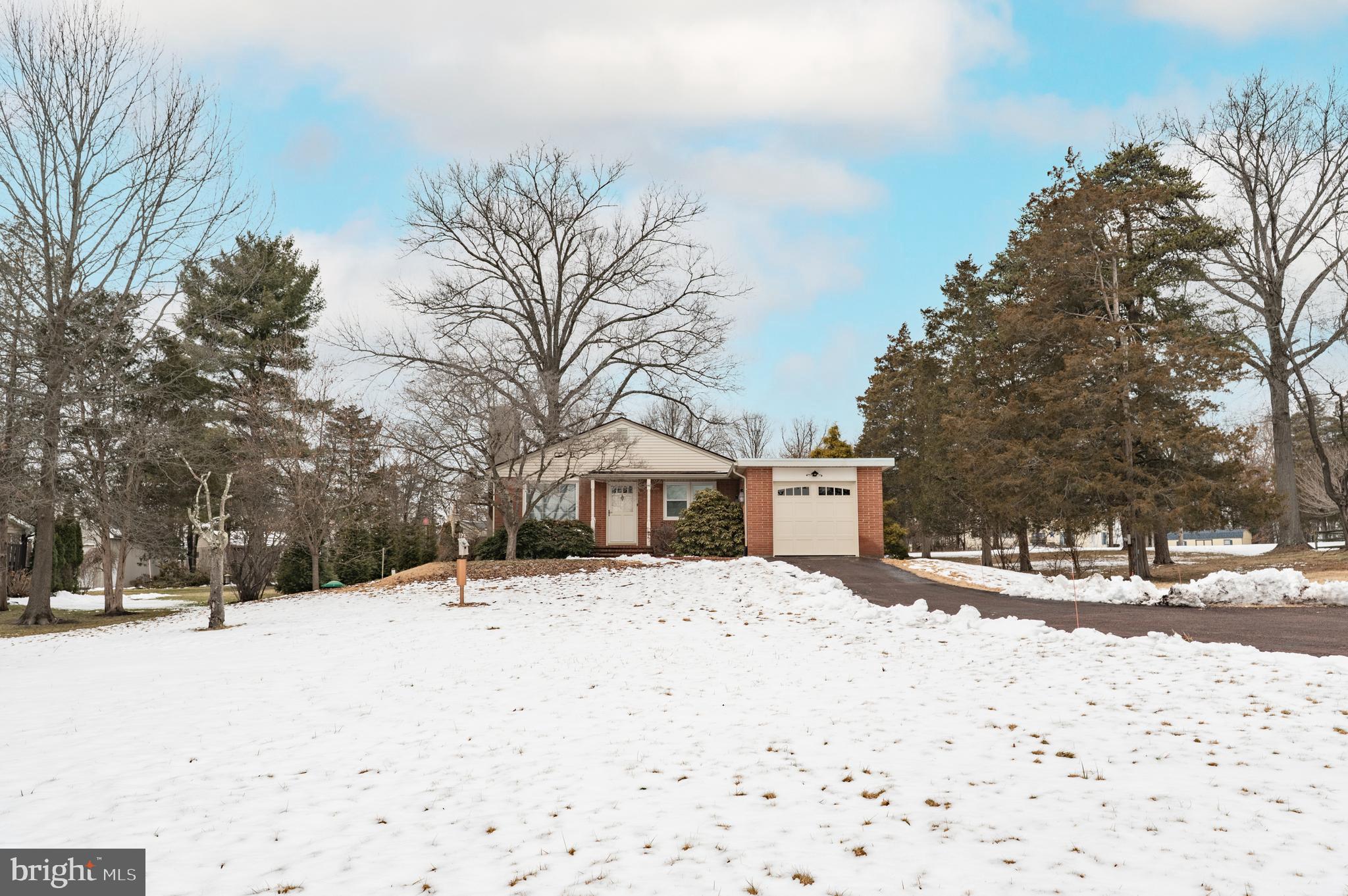 915 Cressman Road Harleysville, PA 19438 - Photo 3 of 39 a street view covered with snow