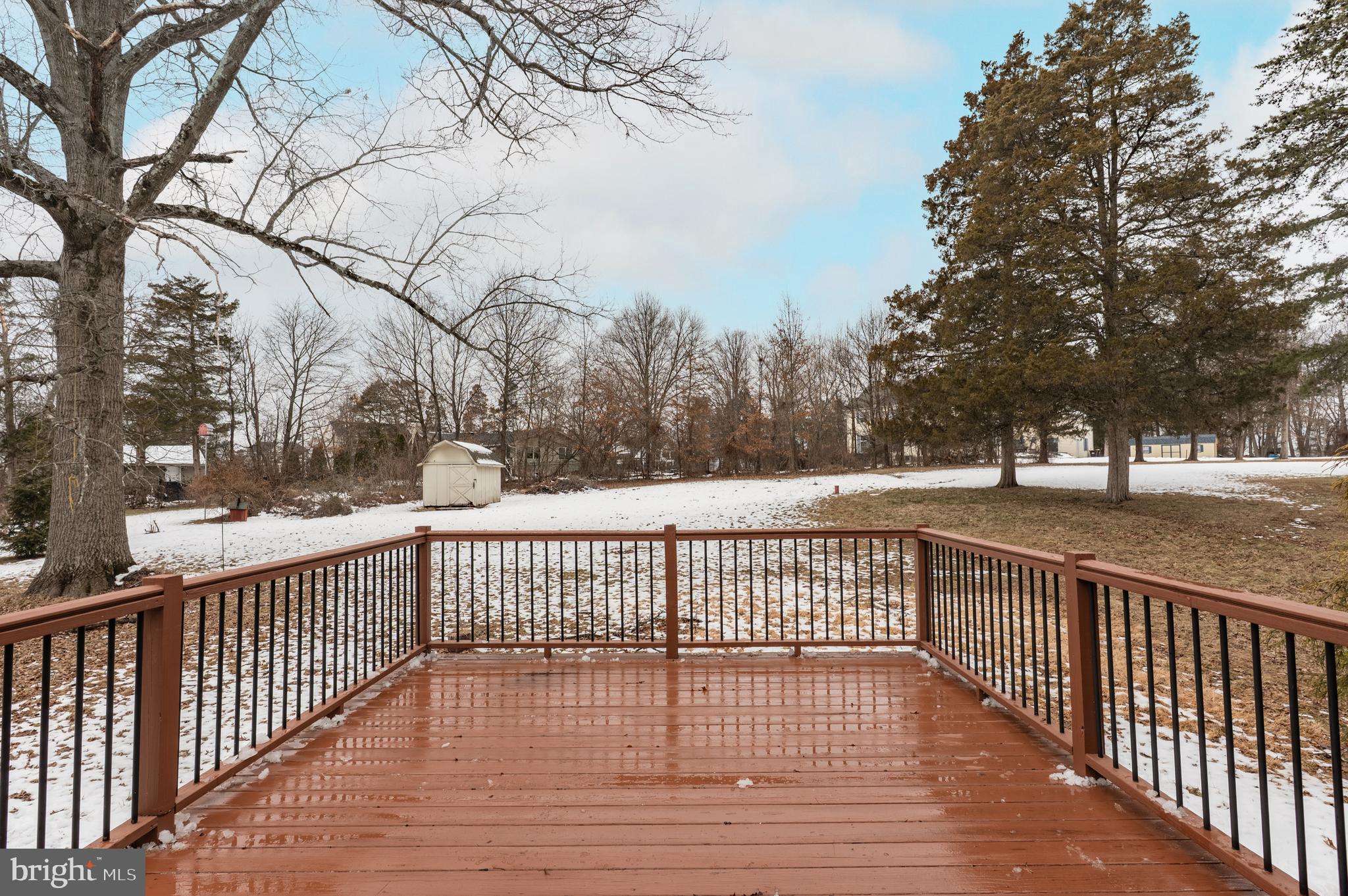 915 Cressman Road Harleysville, PA 19438 - Photo 32 of 39 a view of a yard with wooden fence and trees