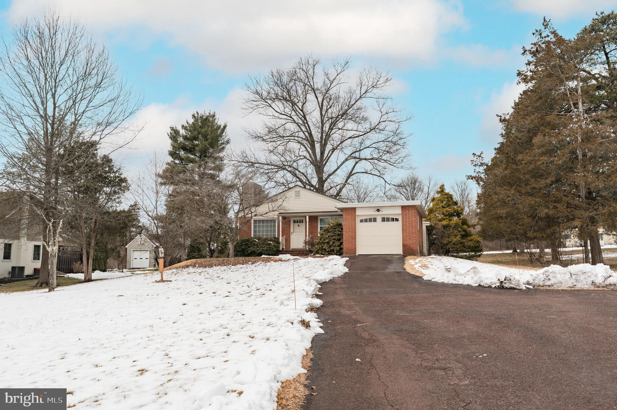 915 Cressman Road Harleysville, PA 19438 - Photo 4 of 39 a street view covered with snow