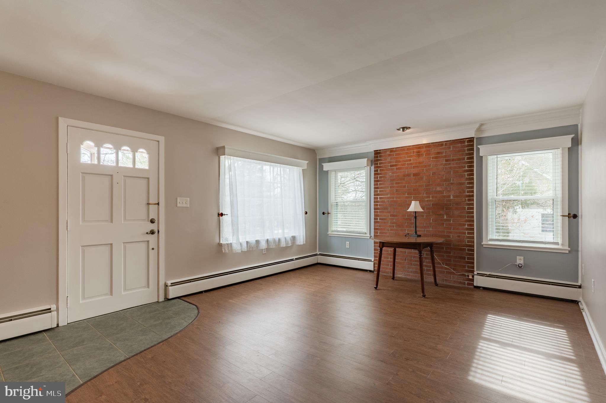 915 Cressman Road Harleysville, PA 19438 - Photo 5 of 39 wooden floor in an empty room with a window
