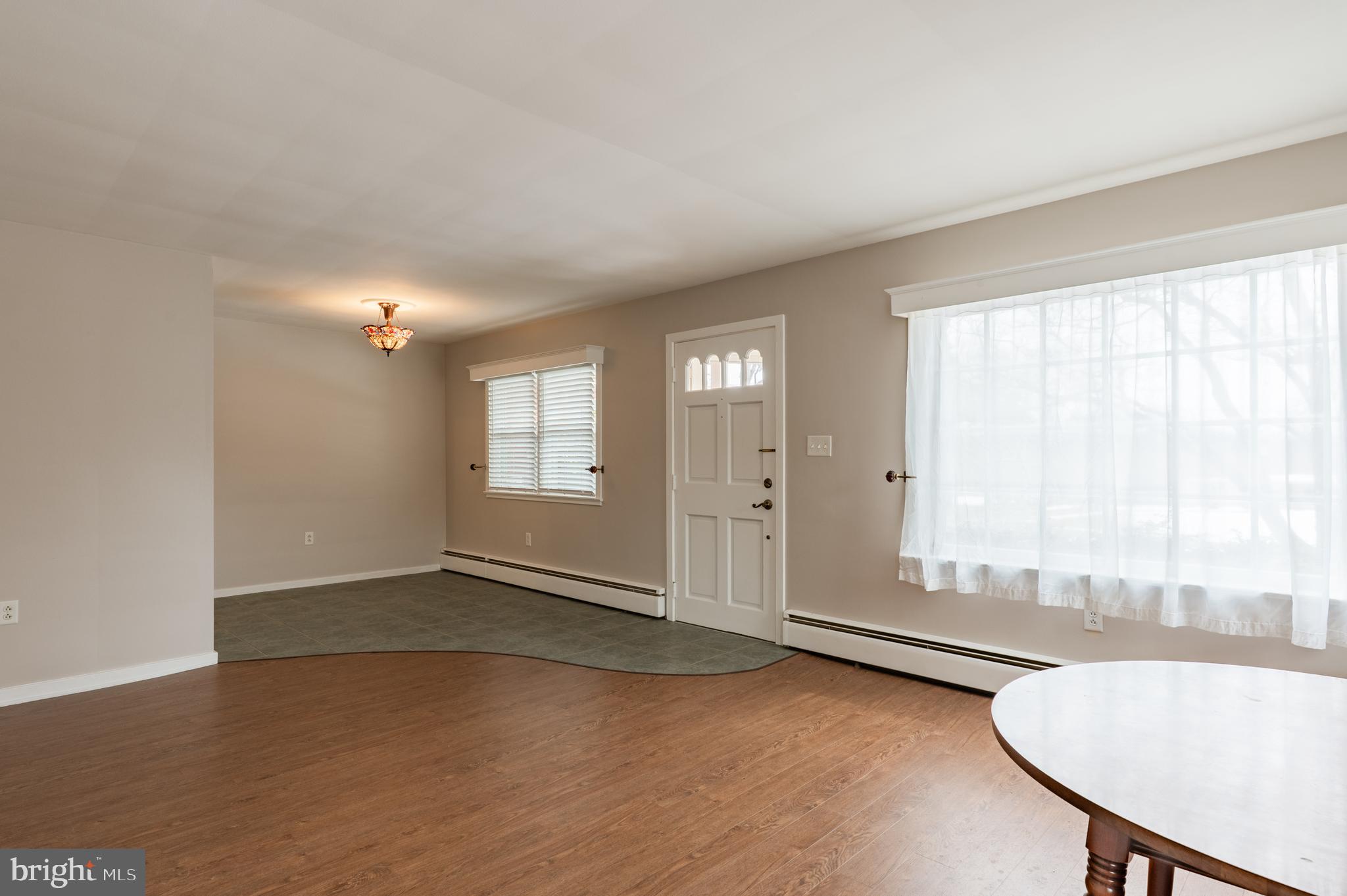 915 Cressman Road Harleysville, PA 19438 - Photo 6 of 39 wooden floor in an empty room with a window