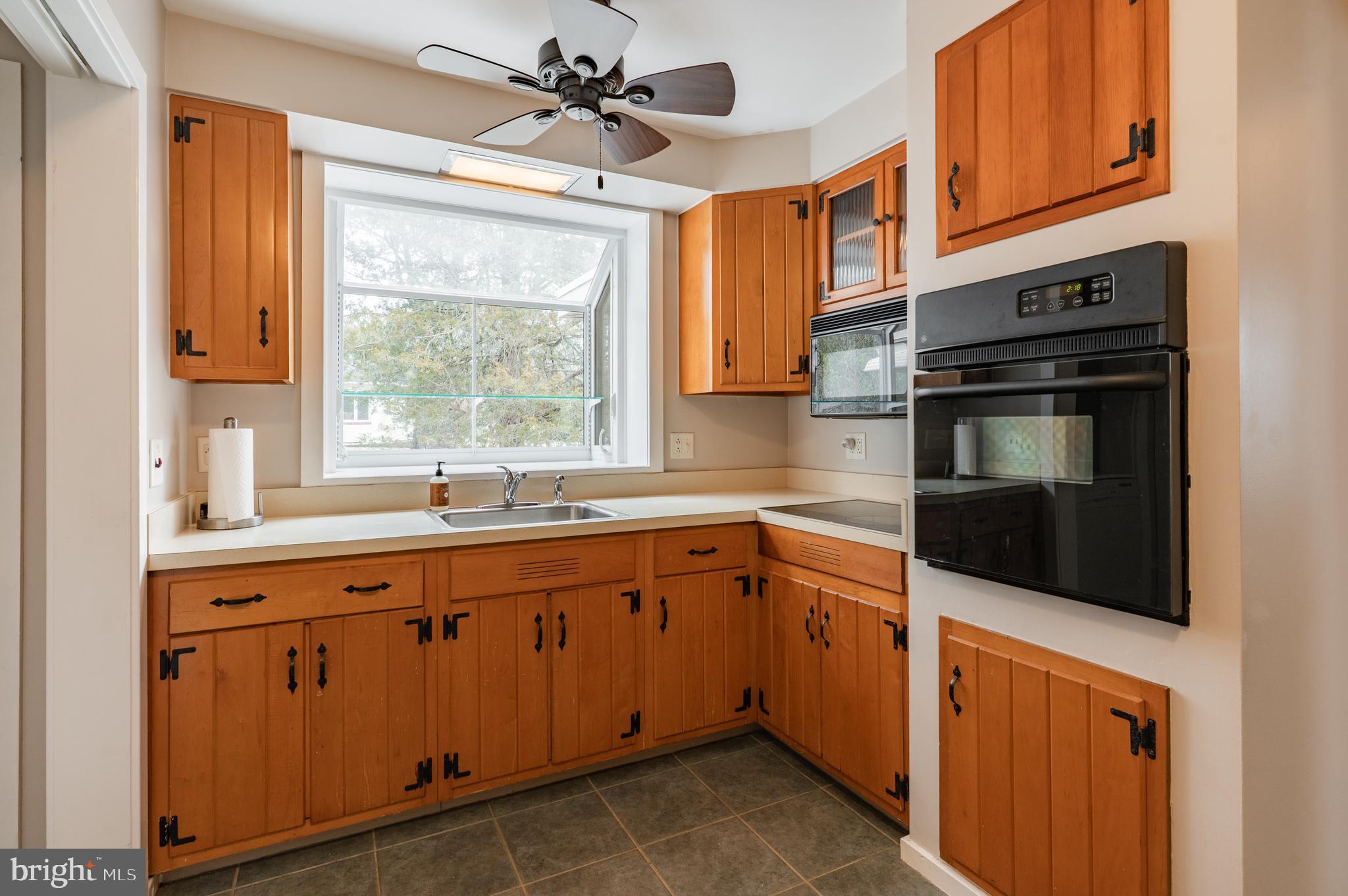 915 Cressman Road Harleysville, PA 19438 - Photo 10 of 39 a kitchen with a sink stove and microwave