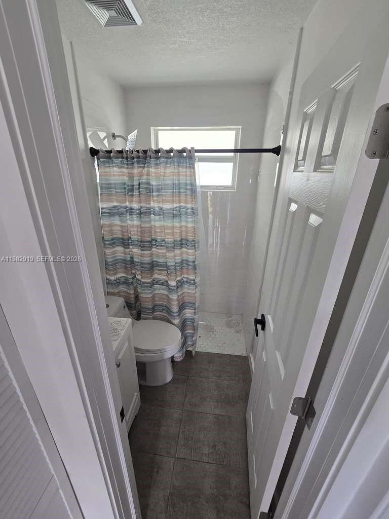 26633 Southwest 138th Court, Unit 1 Homestead, FL 33032 - Photo 5 of 8 a bathroom with a sink and toilet