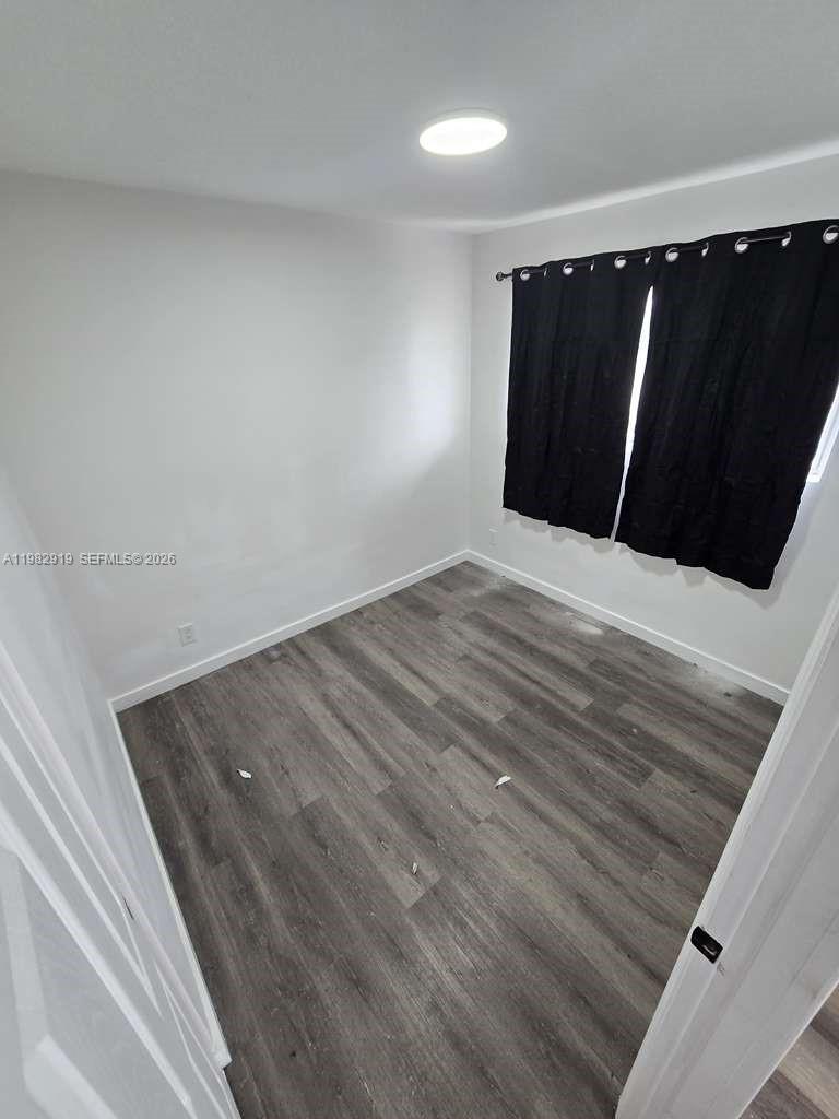 26633 Southwest 138th Court, Unit 1 Homestead, FL 33032 - Photo 8 of 8 a view of wooden floor with staircase
