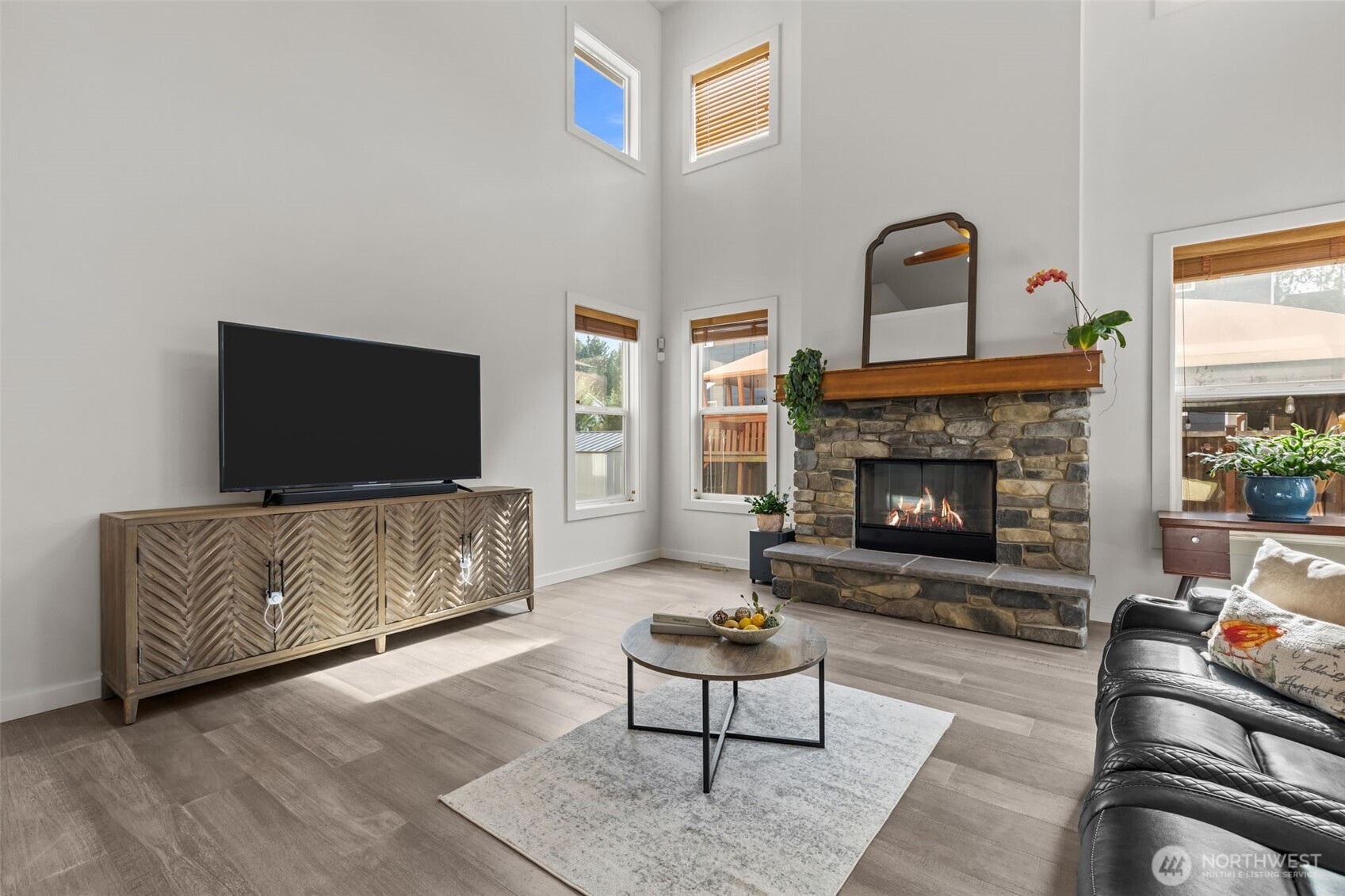 33303 Northeast 42nd Street Carnation, WA 98014 - Photo 17 of 39 a living room with furniture and a fireplace