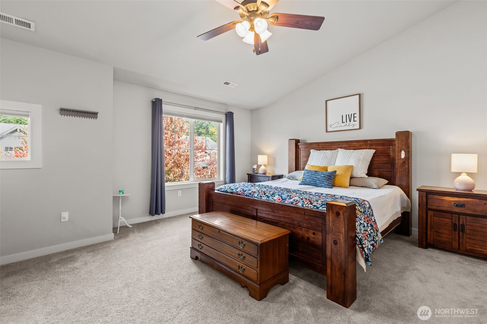 33303 Northeast 42nd Street Carnation, WA 98014 - Photo 22 of 39 a spacious bedroom with a bed and a chandelier