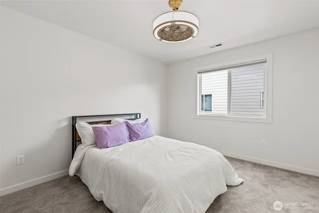 a bedroom with a bed and a cabinets