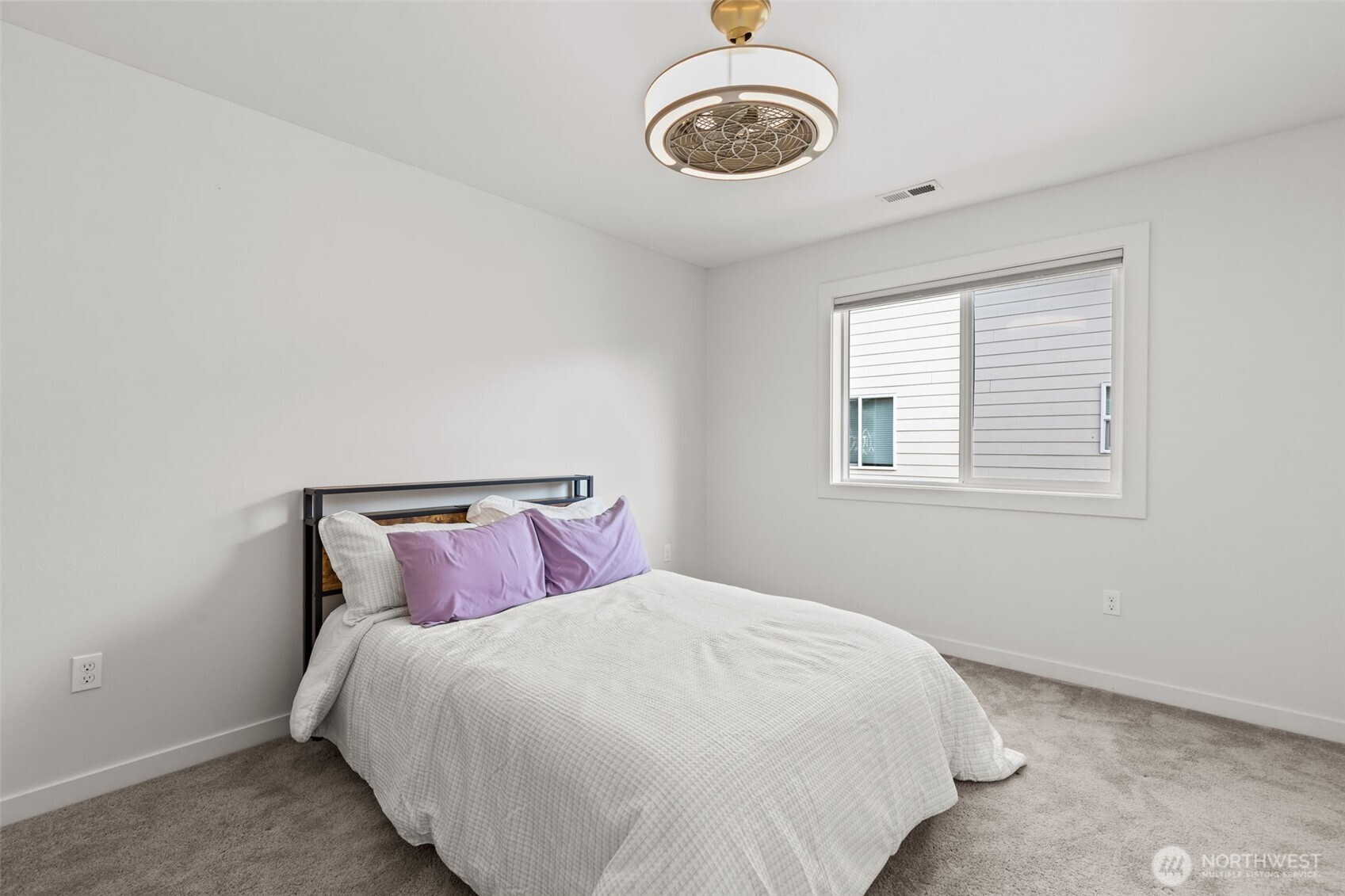 33303 Northeast 42nd Street Carnation, WA 98014 - Photo 29 of 39 a bedroom with a bed and a window